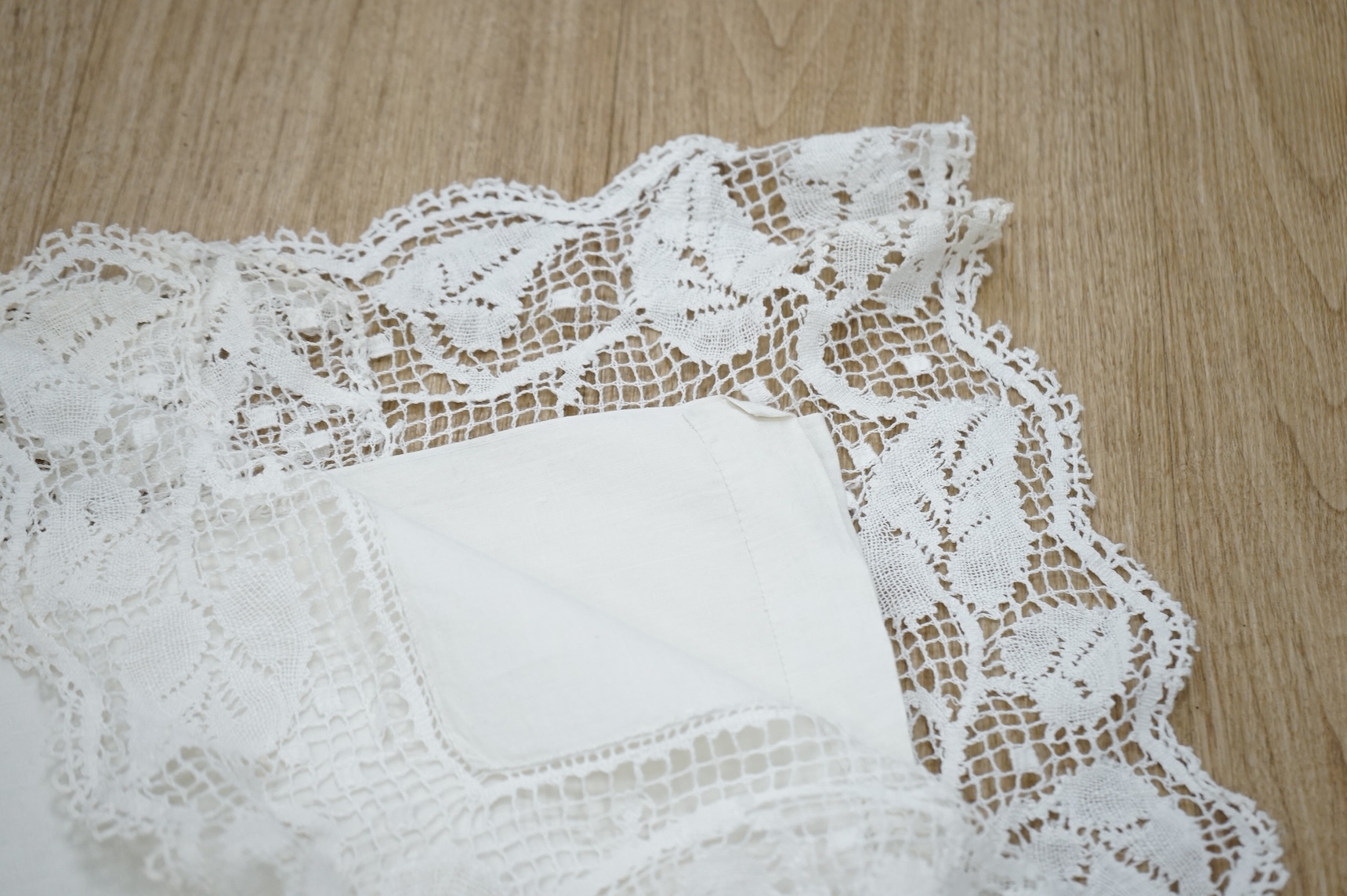A French provincial linen sheet with lace edge and insertions plus a pair of similar sheets with drawn thread and monograms